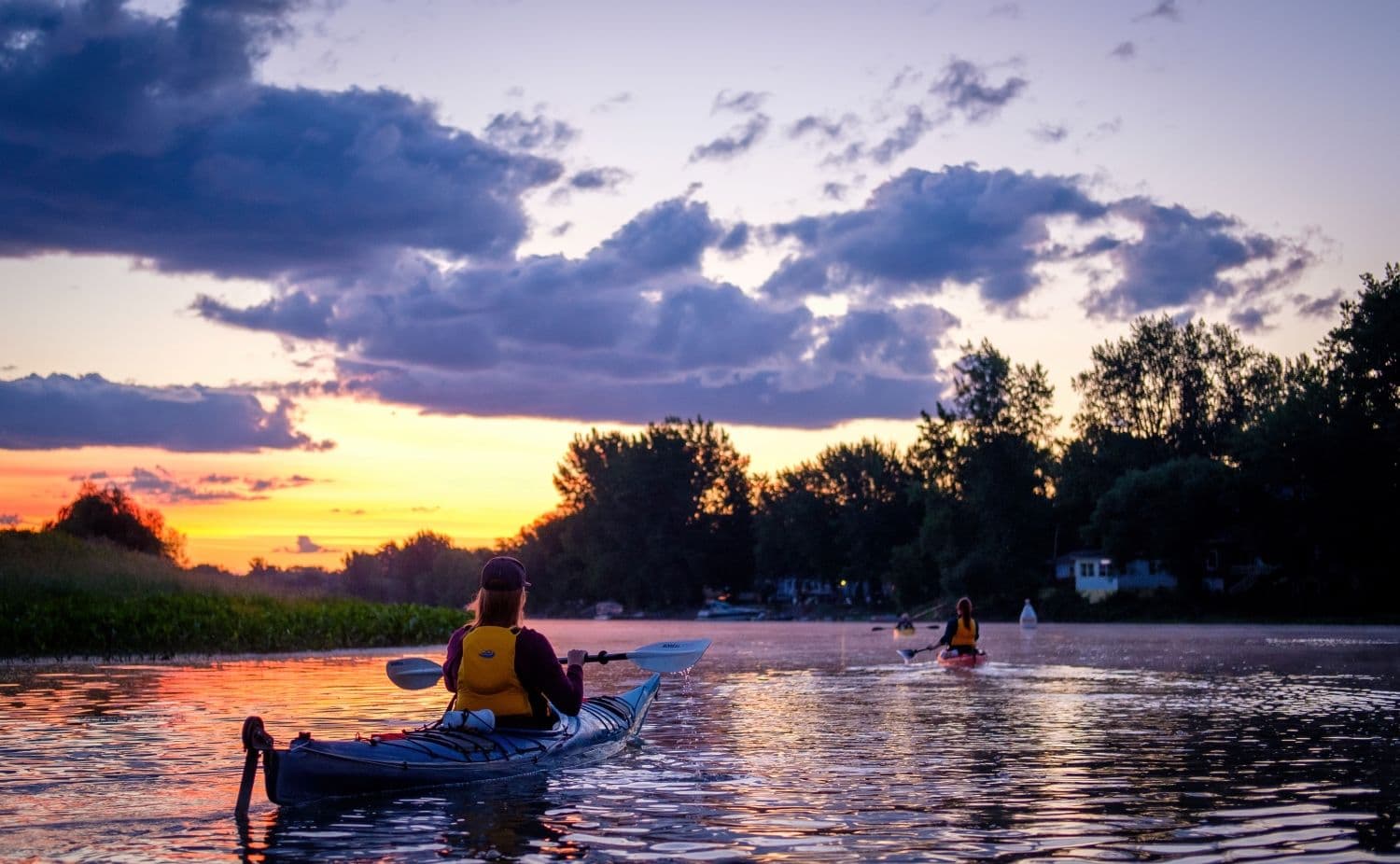 People kayaking on a river